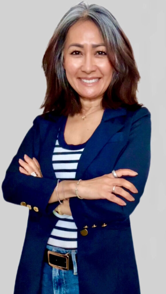 Meesh smiling — content creator and social media manager who provides social media support for small businesses
